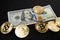 Piled up 100 Dollar Banknotes surrounded by Gold Bitcoin Coins. Digital Crypto Currency with US Dollar Currency