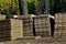 Piles of access mats used to build roads in wet areas