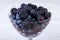Piles of Blueberries and blackberries in a crystal Bowl