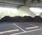 Piles of brown mulch under a bridge