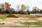 Piles of dirt hauled into vacant residential lot in early spring to prepared for construction