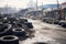 piles of discarded tires in a deserted junkyard