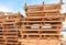 piles of european pallets made in wood ready to be used transporting products or goods on them from a place to other by truck,