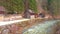 Piles of firewood at the Traun river`s canal, Ebensee, Austria