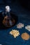 Piles of four different grains and oil in decanter