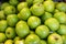 Piles of fresh abundant beautiful delicious bright green apple fruit background selling in local market