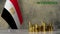 Piles of gold coins on a marble table against the background of the flag of Egypt.