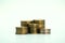 Piles of golden metallic coins. Columns of coins of different heights. The concept of business, economy, finance