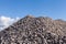 Piles of Gravel at Construction Site under Bright Blue Sky