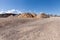 Piles of Gravel at Construction Site under Bright Blue Sky