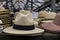 Piles of hats on a market stall