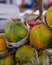 Piles of huge ripe tropical papaya ready for eating at a fruit and vegetable market stall in Southeast Asia