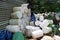 piles of jerry cans, pieces of plastic pipes, buckets and garbage, used containers of chemical industry materials