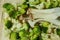 Piles of King Oyster Mushrooms (Pleurotus Eryngii) over bunch of fresh green sliced broccoli on the wooden chopping block