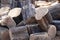 Piles of logs waiting to be cut into firewood.