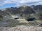 Piles of mountain rocks in the middle  of mountain lakes