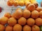 Piles of orange fruits on refrigerator