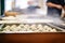 piles of plump dumplings in a steamy vendor tray
