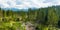 Piles of sawn logs in beautiful Low Tatras alpine landscape. Majestic pine trees of Tatra mountains near Zakopane, Poland