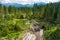 Piles of sawn logs in beautiful Low Tatras alpine landscape. Majestic pine trees of Tatra mountains near Zakopane, Poland