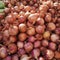 Piles of shallots Fresh produce showcased at a traditional market