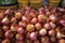 Piles of shallots Fresh produce showcased at a traditional market