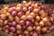 Piles of shallots Fresh produce showcased at a traditional market