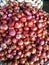 piles of shallots for sale at the Senen Market, Jakarta, Indonesia.