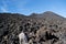 Piles of sloped black lava under the Etna volcano