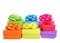 Piles of small colorful bright holiday presents with ribbons and bows isolated