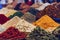 Piles of spices on display at a Moroccan souk market in a medina, generative AI