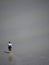 Pilgrim crossing the tidal bay at Mont Saint Michel, France