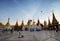 Pilgrim praying at golden Shwedagon Pagoda in Yangon, Myanmar