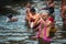 Pilgrims plunge into the water holy Ganges river in the early morning.