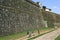 Pilgrims walk along giant, ancient, city wall, Valenca