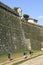 Pilgrims walk along giant, ancient, city wall, Valenca