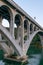 Pilings and arches of the Rogue River bridge in Gold Beach, Oregon at sunset