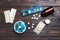 Pill boxes with medicaments on wooden table, flat lay