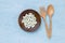 Pill in round wooden plate with wooden fork and spoon