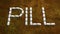 PILL WORD ON A RUSTY METAL PLATE