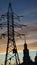 Pillar with power lines and temple against the sky dawn