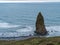 A pillar shaped sea stack off the beach at Cape Blanco State Park, Oregon, USA