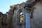 The pillared room of Bellapais Abbey, where meetings were once held, with a column and a barred window. White Abbey, the Abbey of