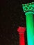 Pillars decorated for holiday season with red and green lights