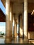 The pillars and part of the outer side of the mosque walls are illuminated by the morning sun