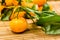 Pille of tangerines on the wooden table cloth