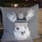 Pillow, rabbit with traditional bobble hat on knitted grey pillow, alpine style in Switzerland