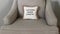 A pillow that says welcome beach people in a condo in Florida