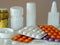 Pills in blisters and separately, glass and plastic containers with various medicines. Medical background for business, pharmacies