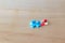 Pills blue and capsule On wooden floor with copy space add text